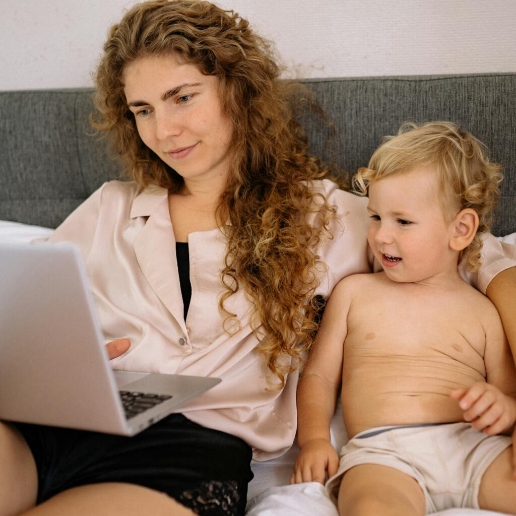 Mom working while looking after her baby